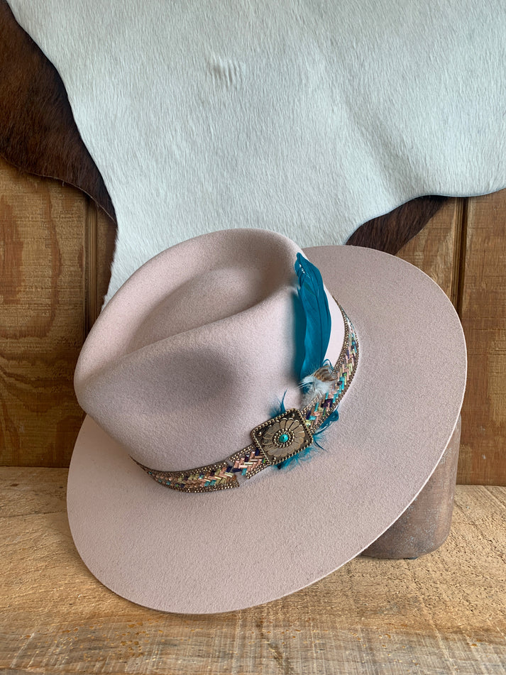 Various cowboy hats displayed together, featuring styles from Resistol, Stetson, Ariat, Charlie 1 Horse, and Lainey Wilson