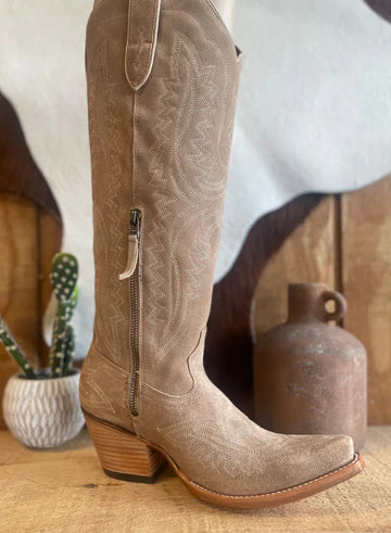 Variety of women's Ariat footwear including cowboy boots, work boots, and casual Western shoes.