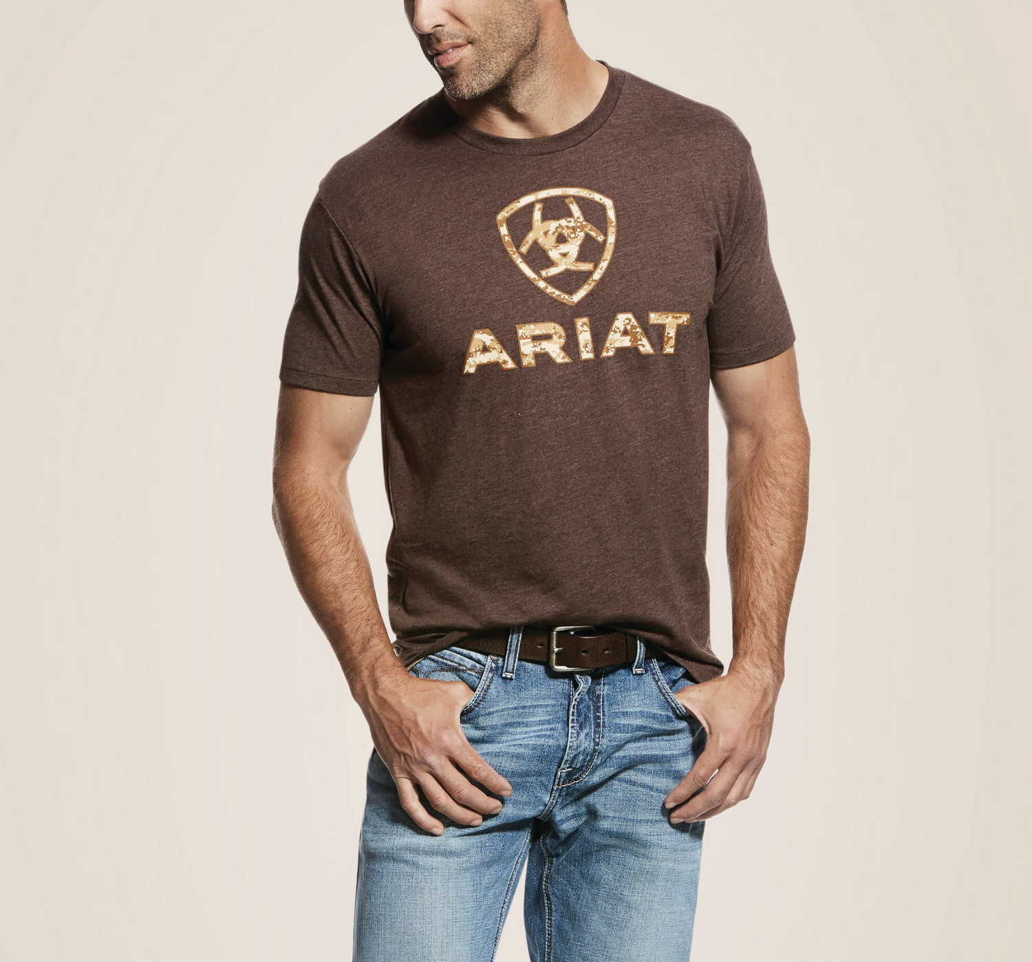 man wearing brown ariat shirt and wrangler jeans