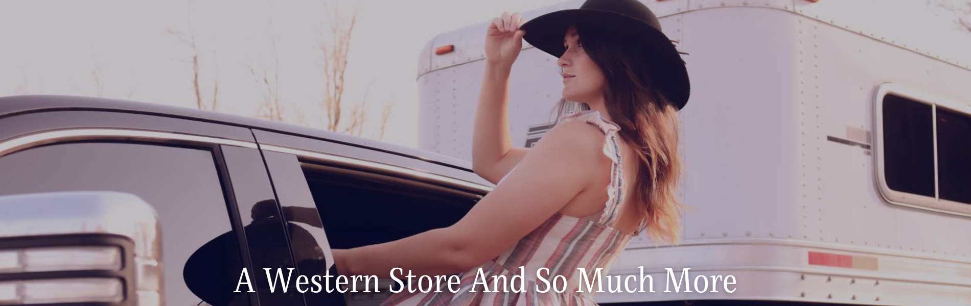 woman leaning out of drivers side window of black truck