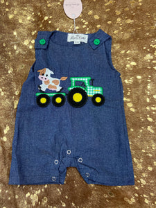 Chambray cow on tractor